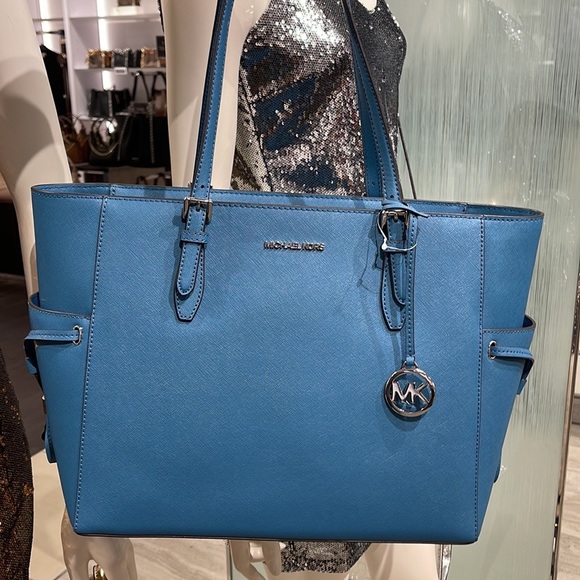 Michael Kors Gilly Large Drawstring Travel Leather Top Zip Tote
 Color: TEAL
NWT - Picture 8 of 16